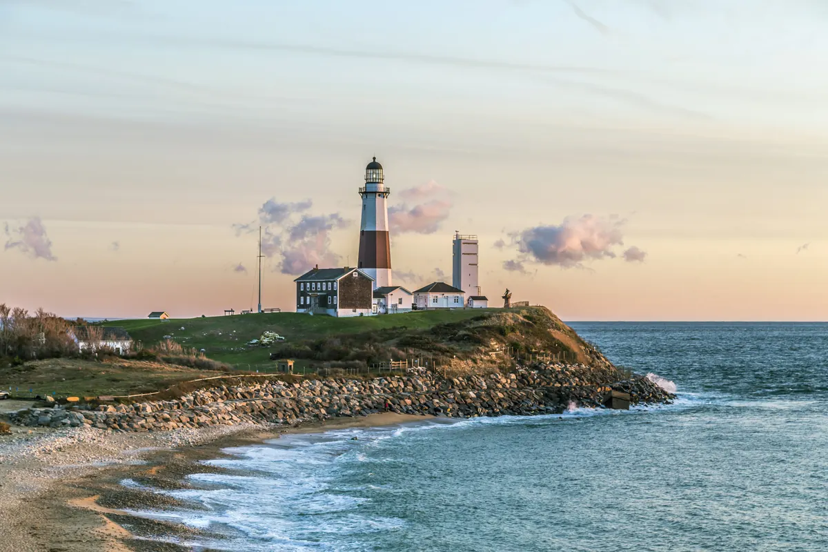 Atlantic ocean waves on the beach at Montauk Point Light, Lighthouse, Long Island, New York, Suffolk County.